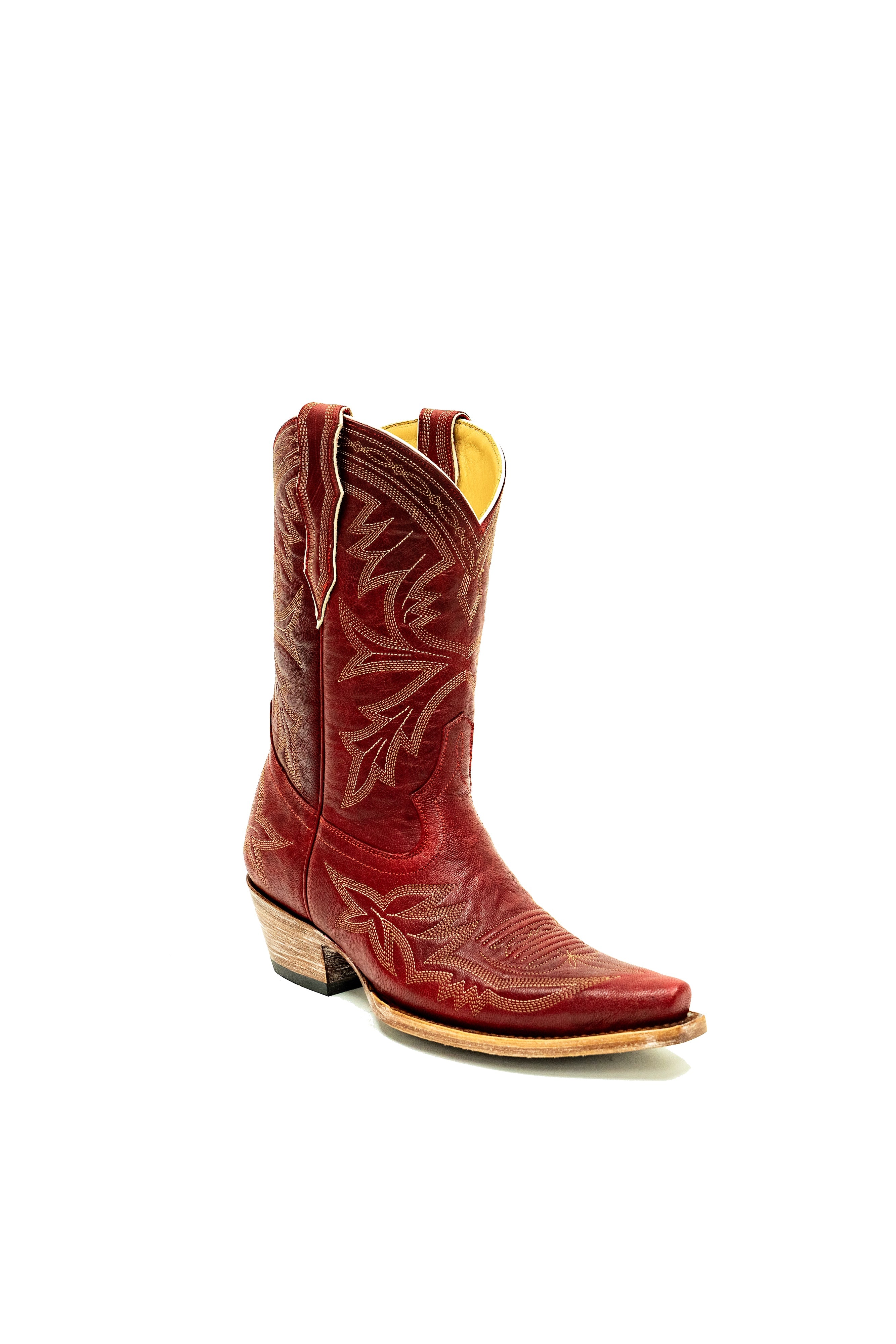 3/4 turn of red cowboy boot with white intricate designs on a white background