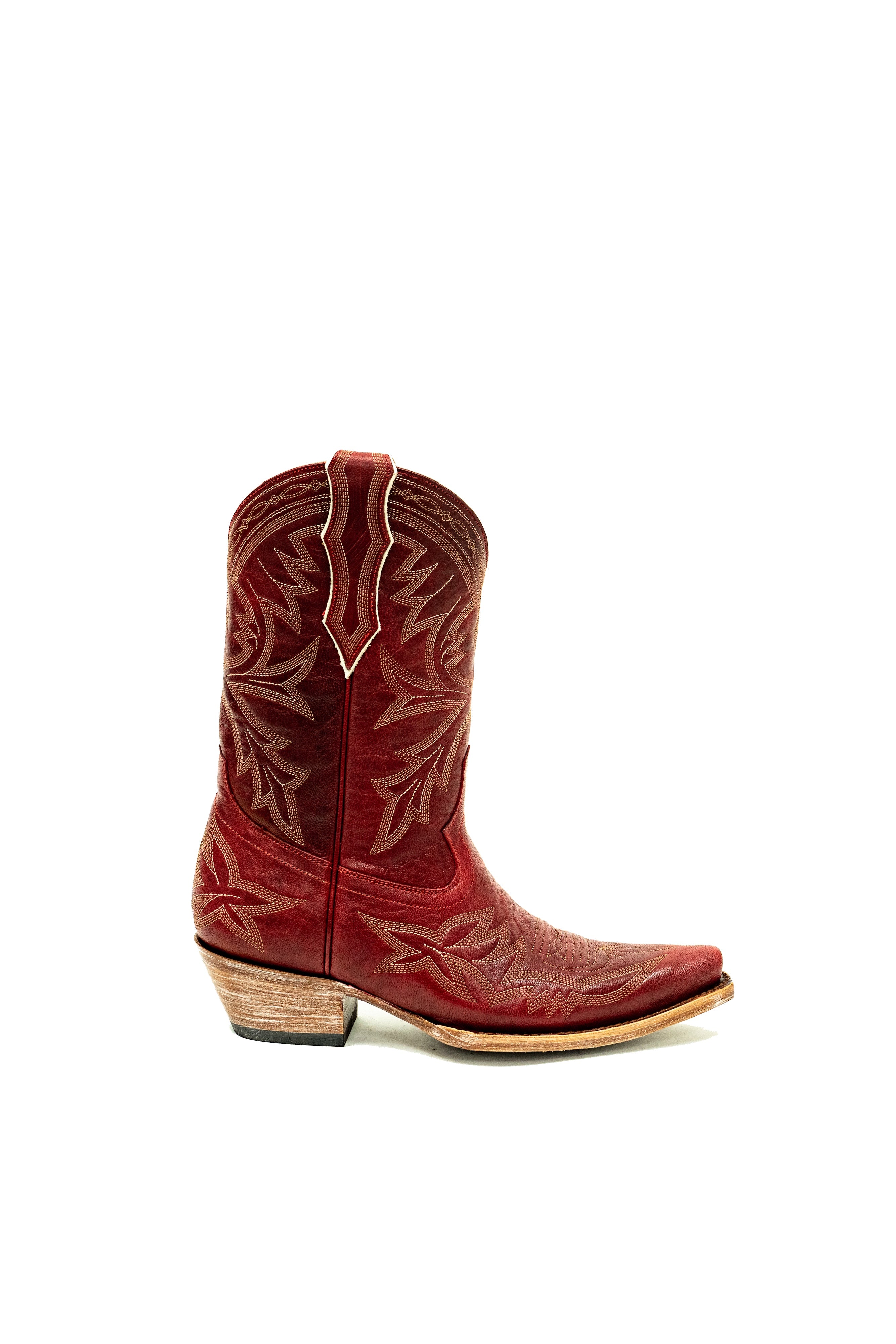 Right side of red cowboy boot with white intricate designs on a white background