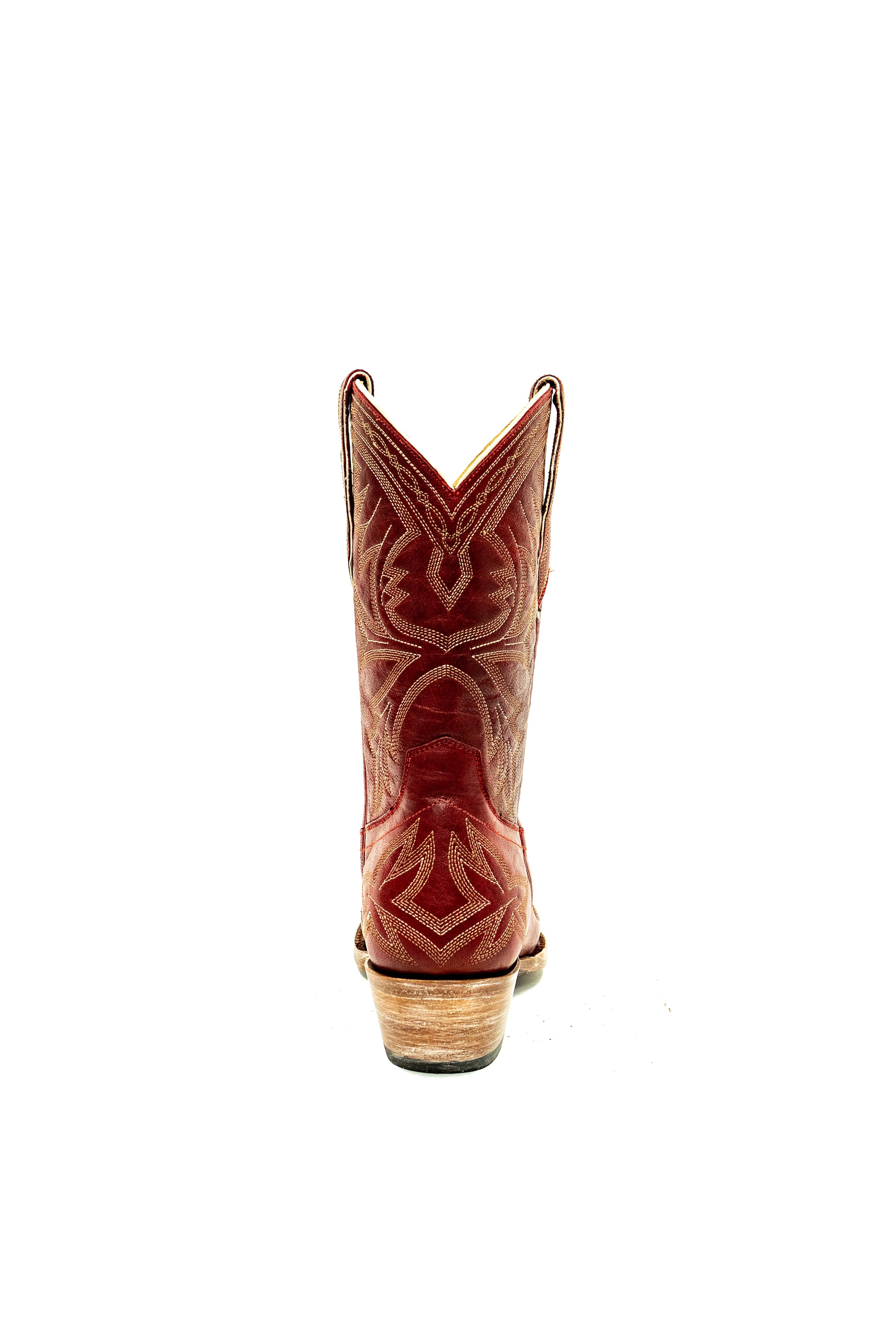 Back of red cowboy boot with a white decorative pattern on a white background